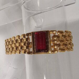 GOLD TONE BRACELET WITH RED RHINESTONE